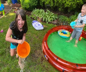 A kiddie pool and some buckets equal tons of backyard fun! Photo by Rose Gordon Sala 
