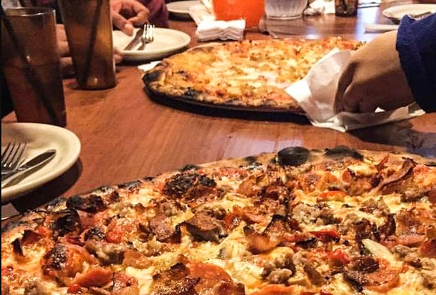 Photo of pizza laden with toppings at a Connecticut pizzeria.