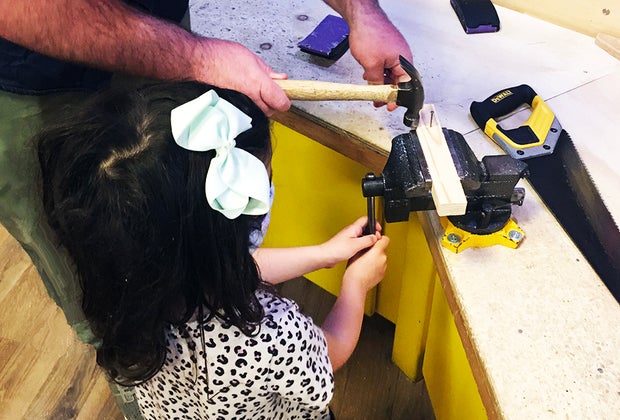 DuPage Children's Museum: girl woodworking