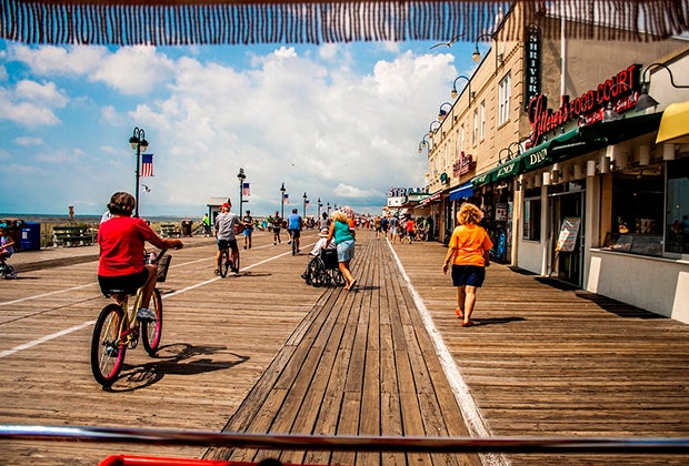 Ride a bike along the ocean on the Ocean City Boardwalk