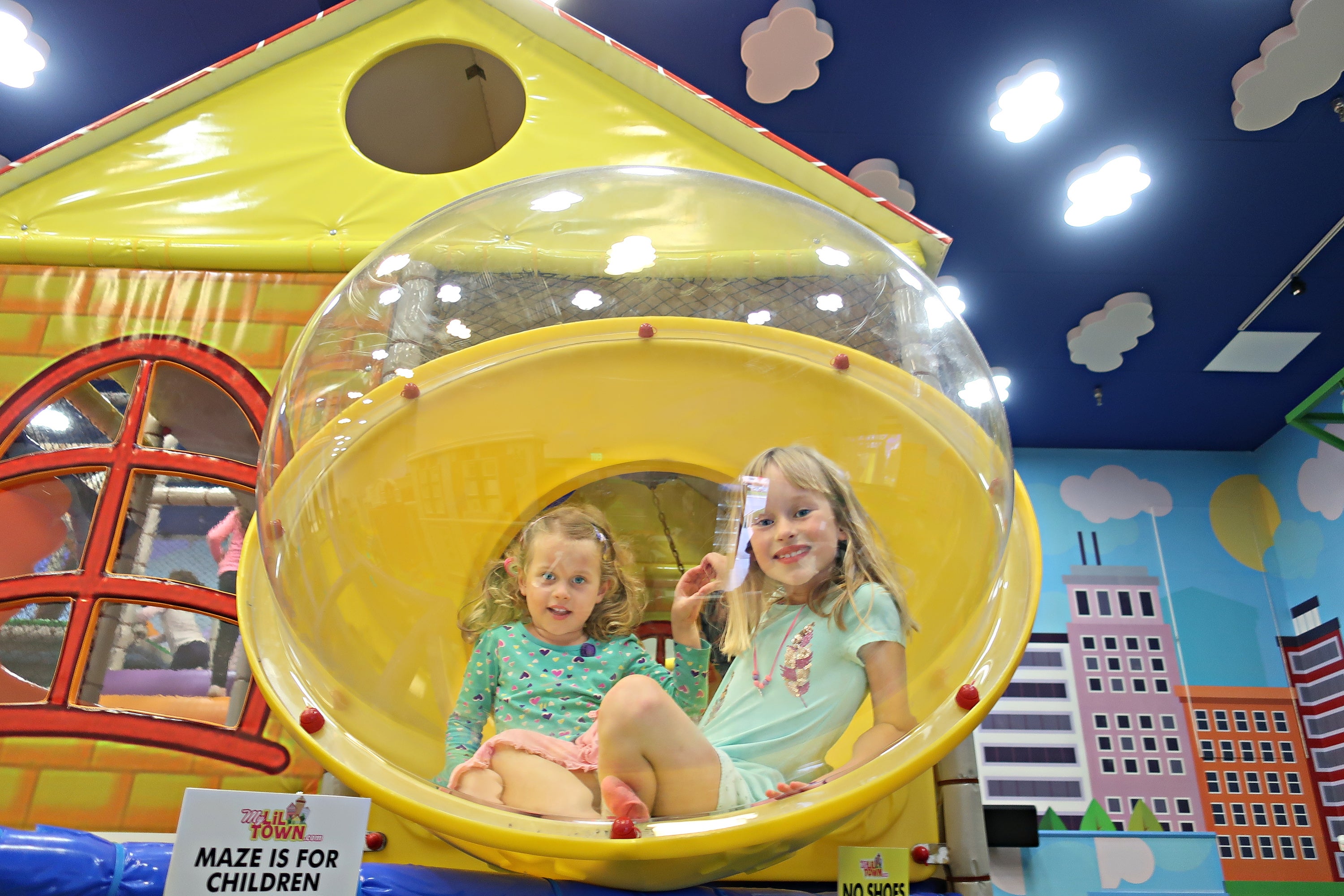Playing on jungle gym at My Lil Town. Photo by author
