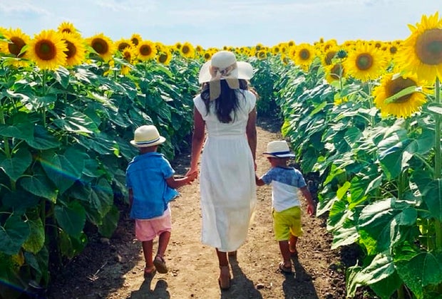 mom and kids walking through a sunflower field Gorgeous Sunflower Fields for Pick-Your-Own Flowers near Chicago