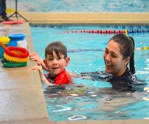 Beloved instructors make kids look forward to pool time! Photo courtesy of the Academy Swim Club