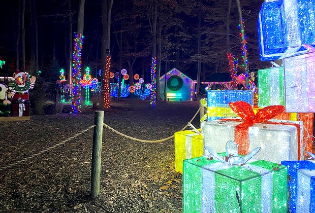 Pile of lit presents at The Village at Anne Ellen