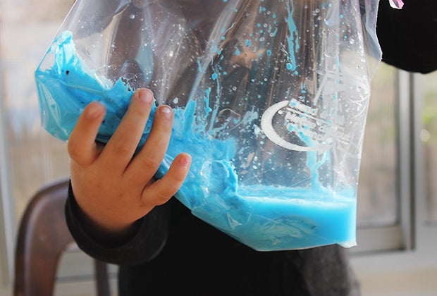 Keep your hands—and home—clean by mixing homemade slime in a resealable baggie.