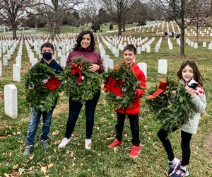Place wreaths at the graves of fallen soldiers during the annual Wreaths Across America event. Photo courtesy of the author