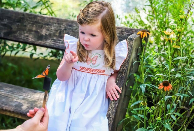 girl in a butterfly garden