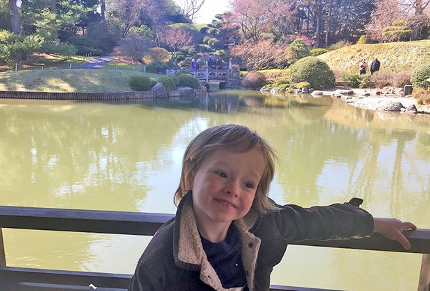 Brooklyn Botanic Garden's The Japanese Hill-and-Pond Garden boy on bridge