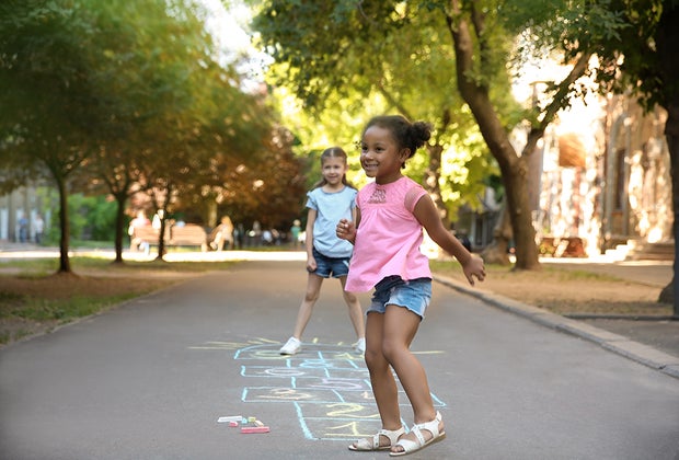 Girls playing hopscotch, can't be bored when you're hopping!