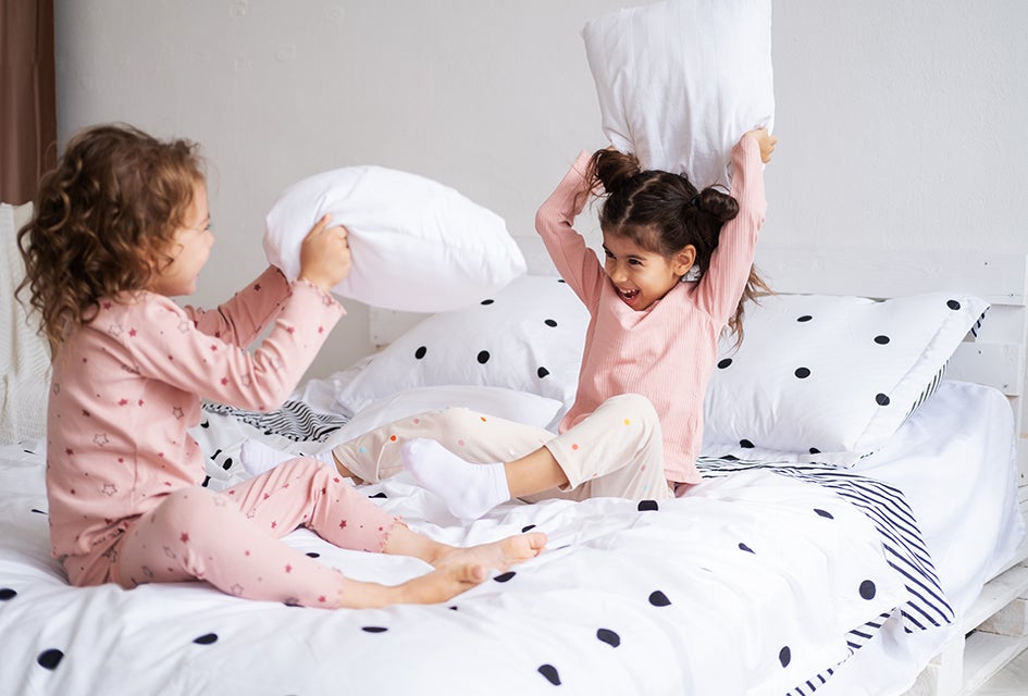Did you know a pillow fight is a great way to get proprioceptive input? Photo by Mommy Poppins