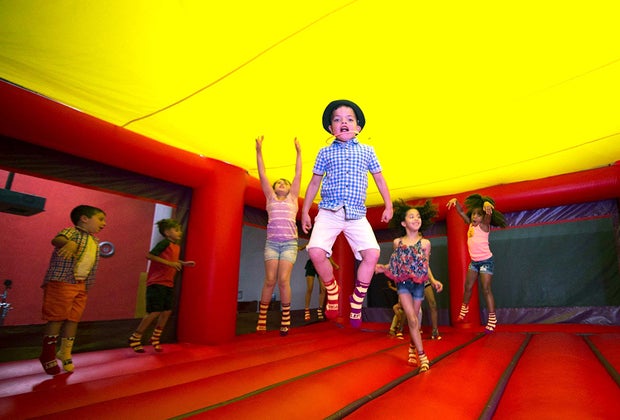 kids jumping in bouncy castle