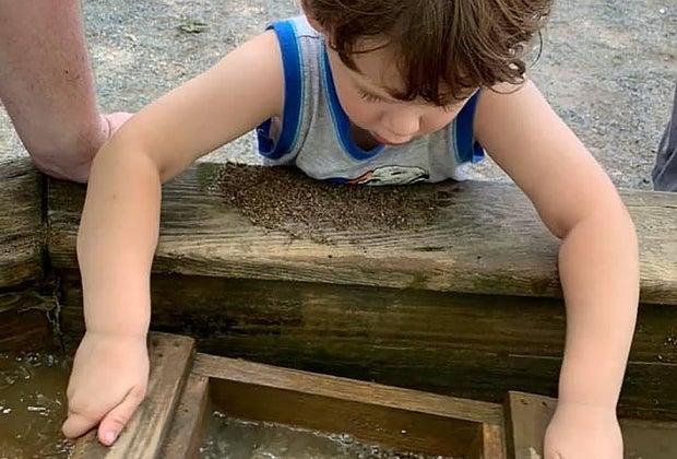 child mining for a gemstone