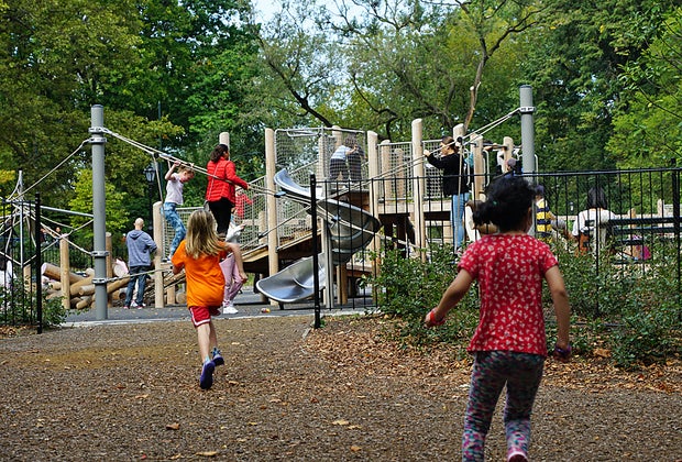 Children race toward Margaret L. Kempner Playground