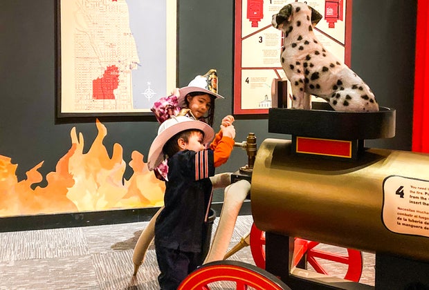 Playing firefighter at the Chicago History Museum.