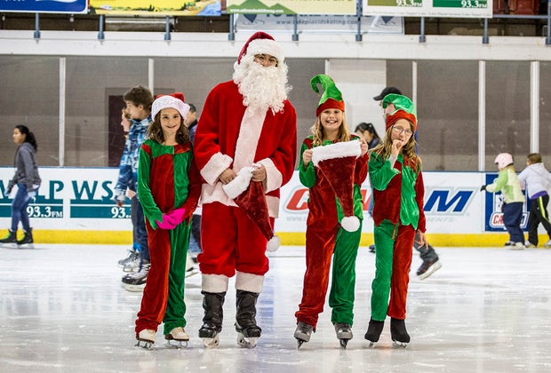 Holiday Village Stroll Santa and elves ice skating