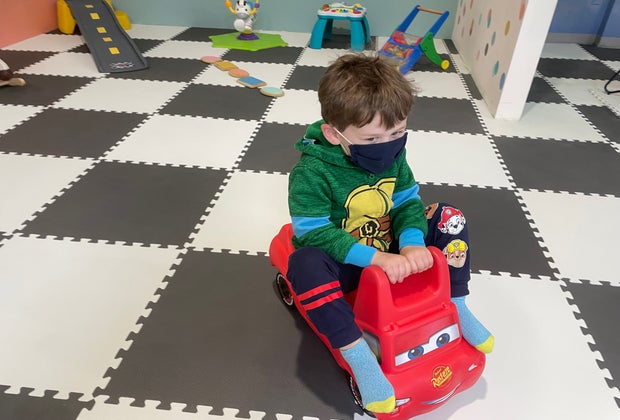 Boy rides kiddie coaster at The Kiddie Clubhouse