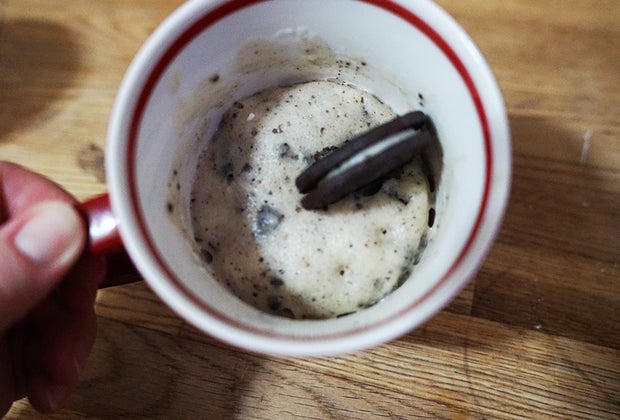 Cookies and Cream Mug Cake topped with an Oreo