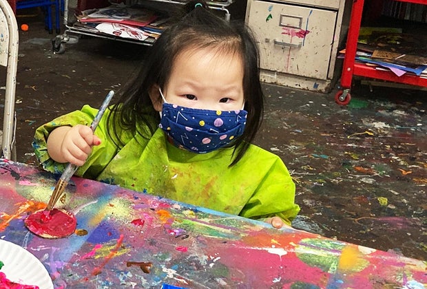chlld creating art at Creative Wild Art Studio.