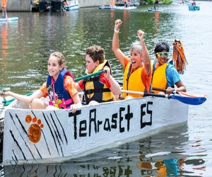 Cheer on your favorite boat at the Lake Anne Cardboard Boat Regatta. Photo by Charlotte Geary, courtesy of the Reston Museum