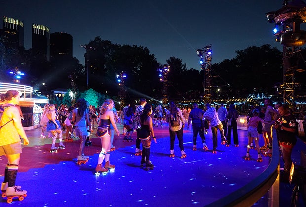 The DiscOasis in Central Park skaters circle the rink