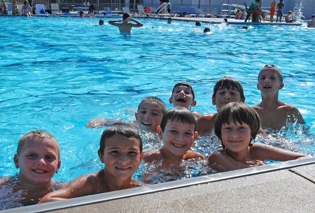 Smiling kids in the pool at Dix Hills Park