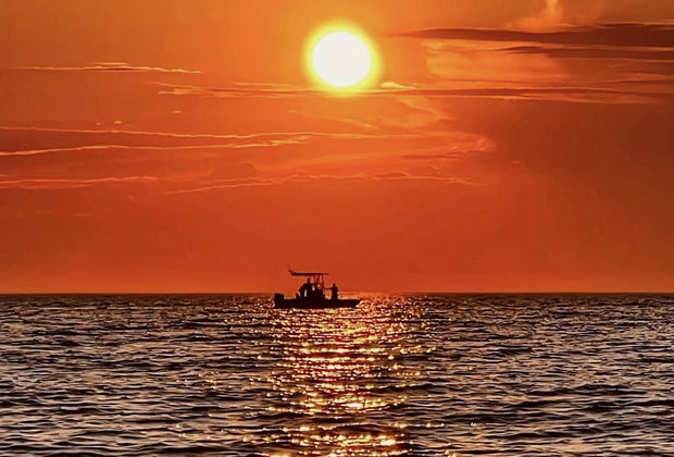 Photo of sunset on the ocean off Cape Cod.