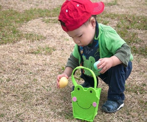 Little boy at an Easter egg hunt. Photo courtesy Canva