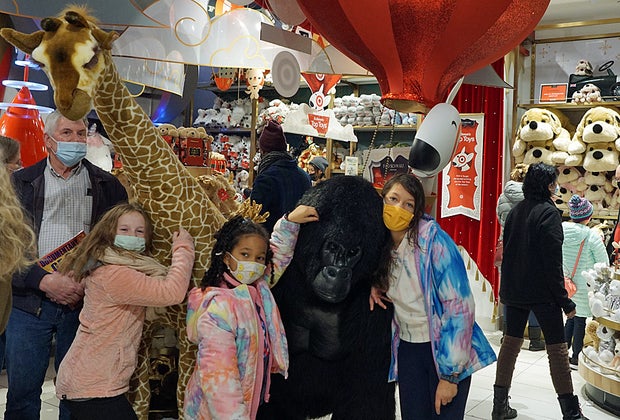 Posing with the larger-than-life stuffed animals at FAO Schwarz