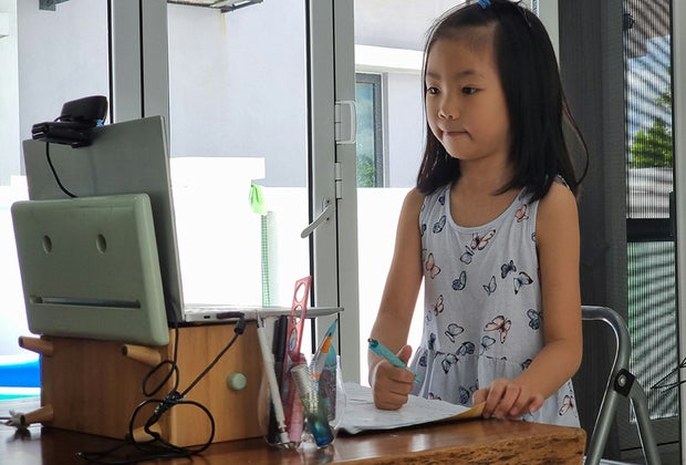 The Best Free Online Summer Camps for Kids in 2025 Girl at computer