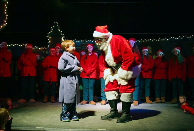 Photo of boy with Santa at Christmas Train Rides in New England.