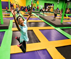 Raise your hand if you love visiting the best indoor trampoline parks in Connecticut! Photo courtesy of Get Air Sports