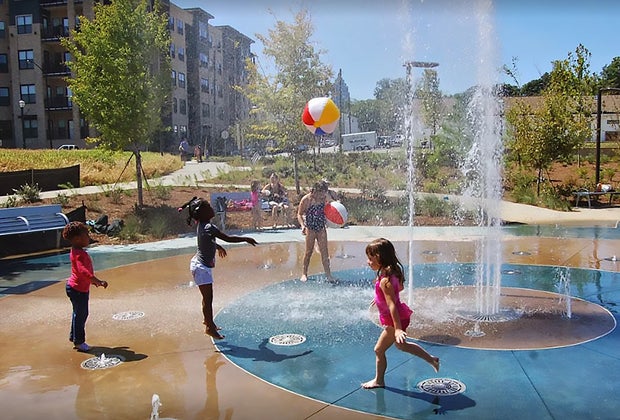 In the warmer months cool down in the splash pad at Historic Fourth Ward Park and Playground.