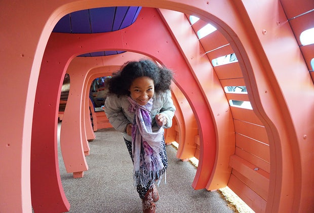 Pier 26 Playground: Girl running through fish jungle gym