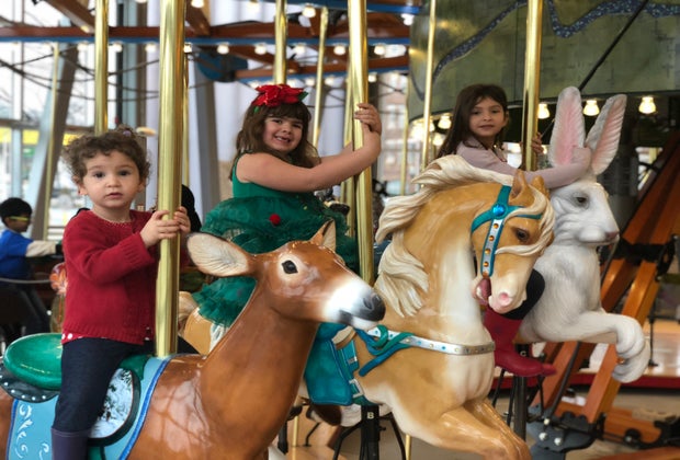 Image of kids on carousel - Hallmark Christmas Movies Filmed in Connecticut