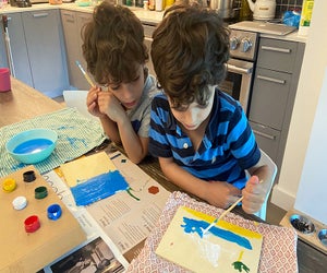 Kids can while away hours of a day with a set of watercolors and a stack of new paper for painting. Photo by Sara Marentette