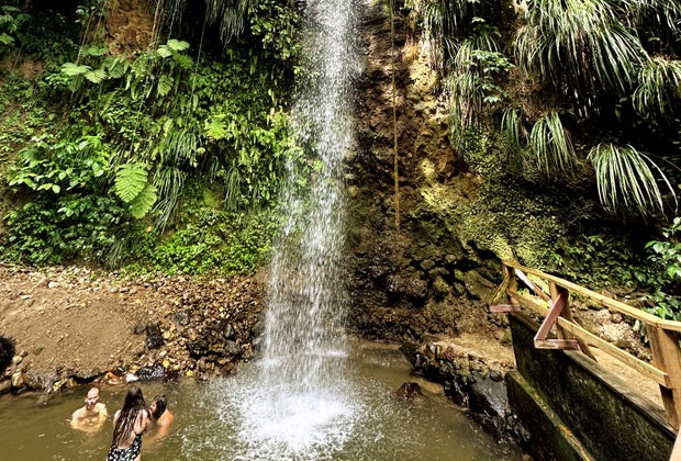 Swimming under the Diamond Falls waterfall.