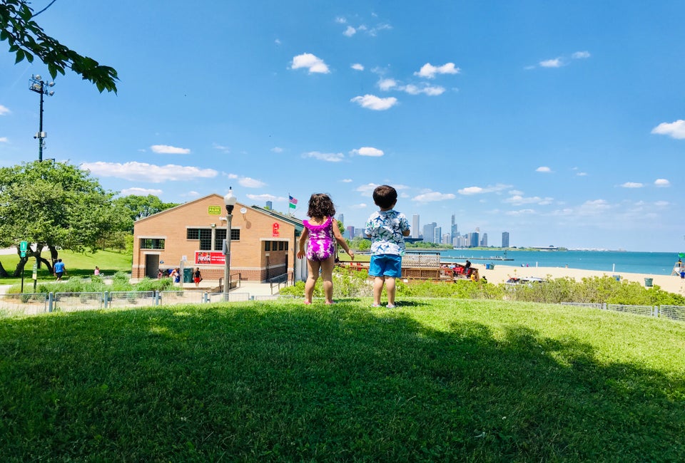 Two little Chicagoans, fresh from the splash pad at 31st Street Harbor, contemplate going to the beach. 
