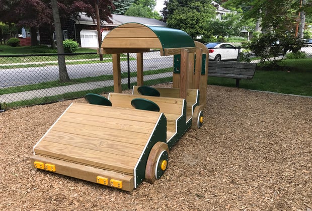 Go for a ride in the toddler-friendly playground at Sunset Park
