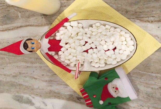 Elf on the Shelf takes a dip in a marshmallow bath