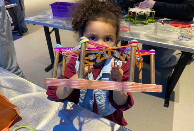 Photo of a child engaged in hands-on activities at Boston's Museum of Science.