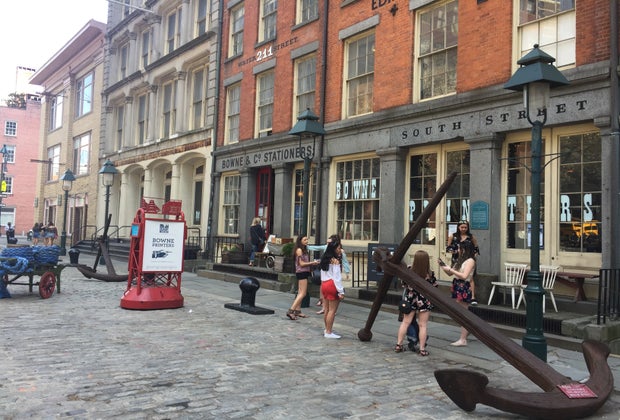 people walking in front of Bowne & Co. Stationers