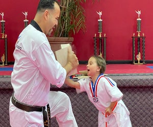 Break the board during a karate class at International Martial Arts.