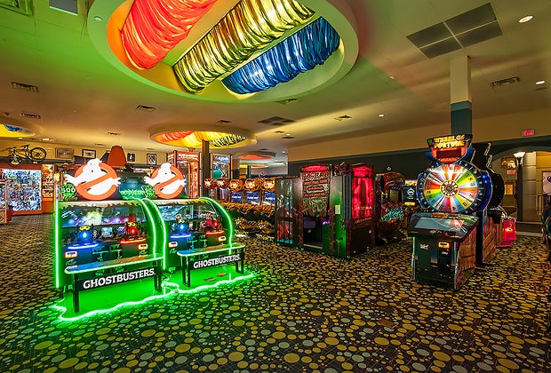 Ghostbusters and Wheel of Fortune are among the classic arcade games at iPlay America. 