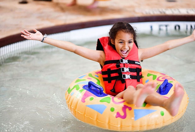 girl in floating in inner tube