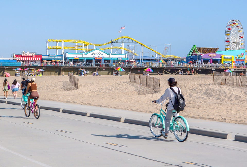 A family bike ride along The Strand is an essential SoCal day. Photo by Meghan Dhaliwal, courtesy of Visit California.