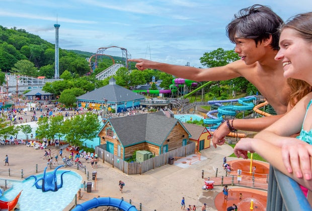 Photo of people looking at rides while visiting Lake Compound Amusement Park