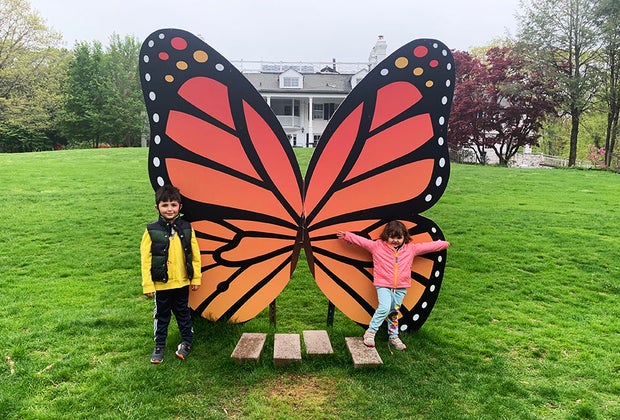 Kids posing with giant butterfly at Lasdon Park & Arboretum