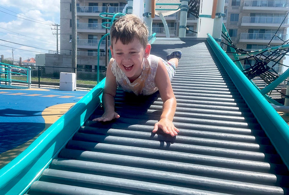 Dive headfirst down the rolling slide, one of Magnolia Park Playground's unique features.