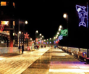 Take the family on a Christmas Day stroll to see the Long Beach Boardwalk Lights. Photo courtesy of Long Beach