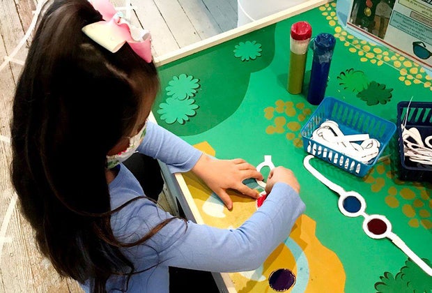 Girl playing with arts and crafts at the Long Island Explorium What's open Now Long Island